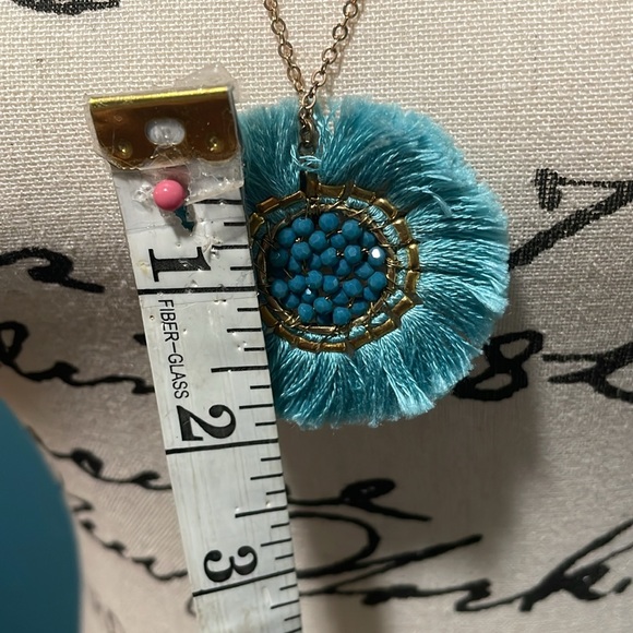Light gold necklace with round teal threaded pendant, small long beads on chain - Picture 7 of 8